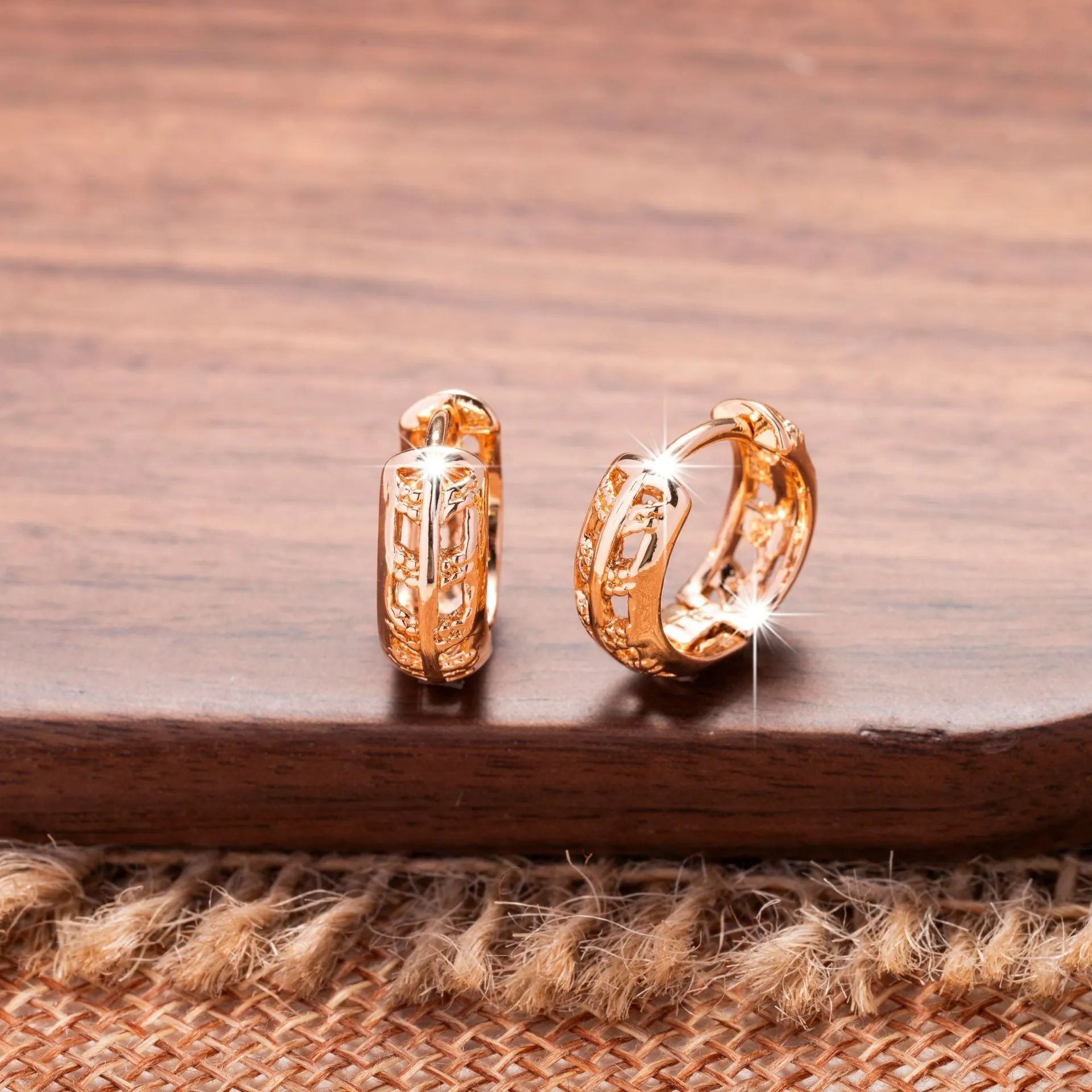 Rose gold plated copper leaf earrings with hollowed out design and heart-shaped detail