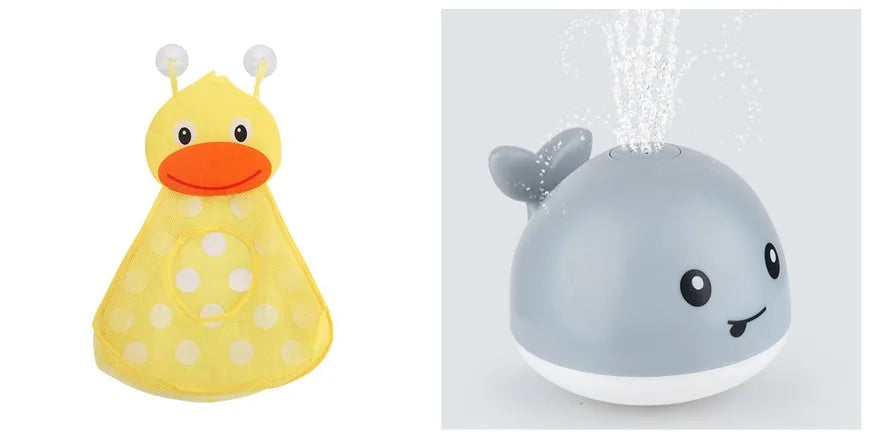 White and blue electric whale bath toy spraying water with lights on a base.