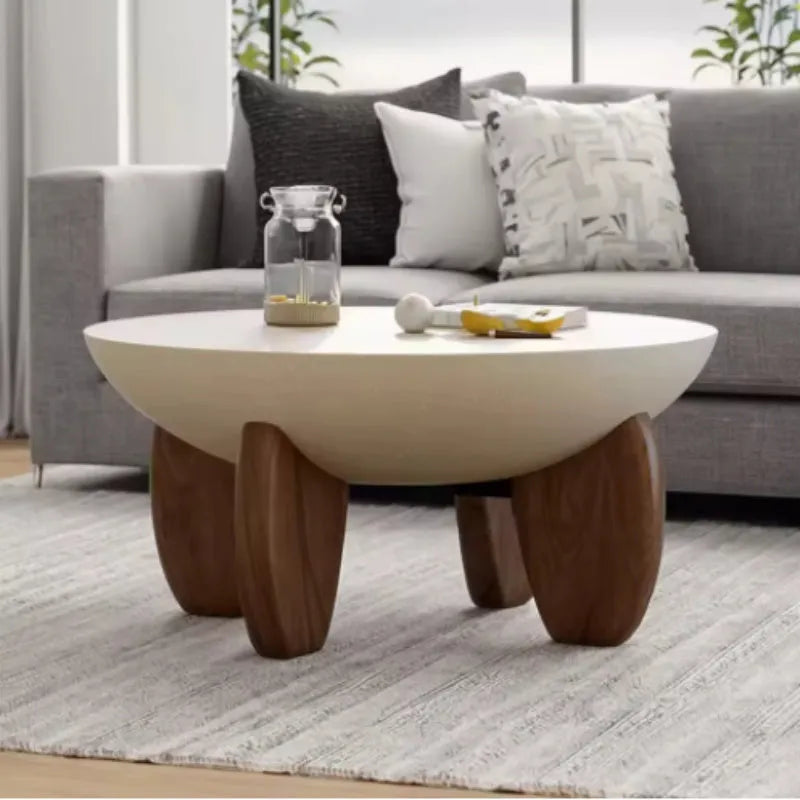 White solid wood coffee table with height adjustable legs and storage in a living room setting