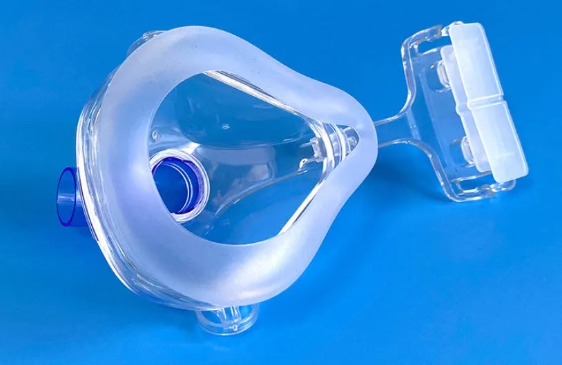 Transparent CPAP breathing mask with headband and adapter elbows for ventilator connection