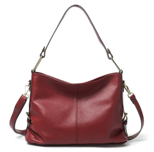 Genuine leather vertical crossbody bag in a square shape with an external sandwich pocket.