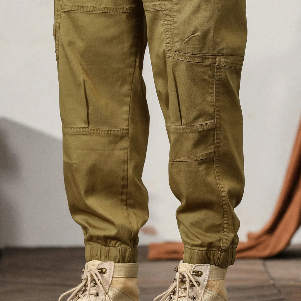 Men's tapered harem trousers in cotton fabric with elastic waist and ankle banding detail