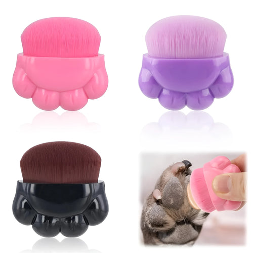 Three dog paw balm brushes with soft fibre heads and paw-shaped plastic handles, each in a small clear storage box