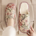 Warm winter linen surface cotton slippers with PVC sole, red flower colour, size 27cm on a wooden floor