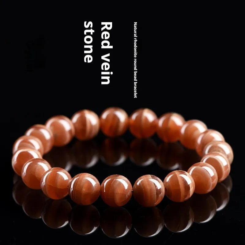 Natural Peruvian old mine rhodochrosite round bead bracelet with geometric design