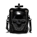 Black mini square crossbody bag with embossed skull design, chain accents, and zipper closure