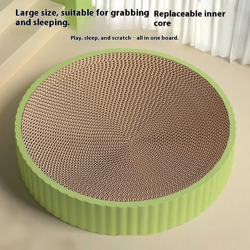 Round green cat scratching board with corrugated cardboard centre measuring 55cm diameter with replacement packs