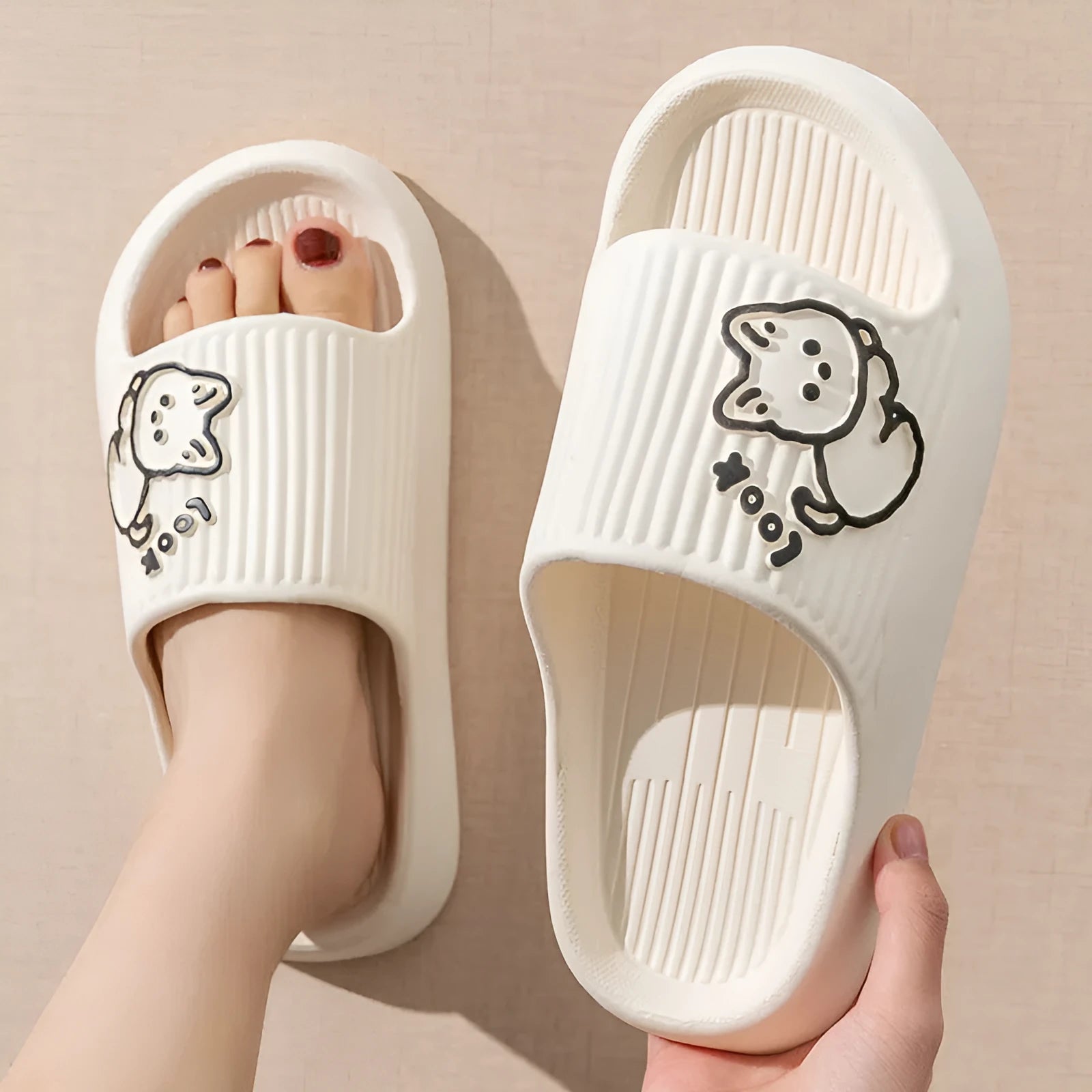 Green EVA platform slippers with a cat design on the upper, showing the thick non-slip sole.