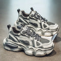 Men's black mesh sneakers with a platform sole and front lace-up closure on a white background.