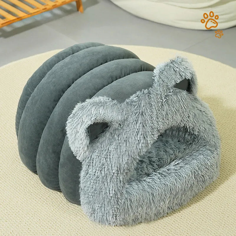Plush cat and dog bed with raised collar and cat ear decoration in blue, size M