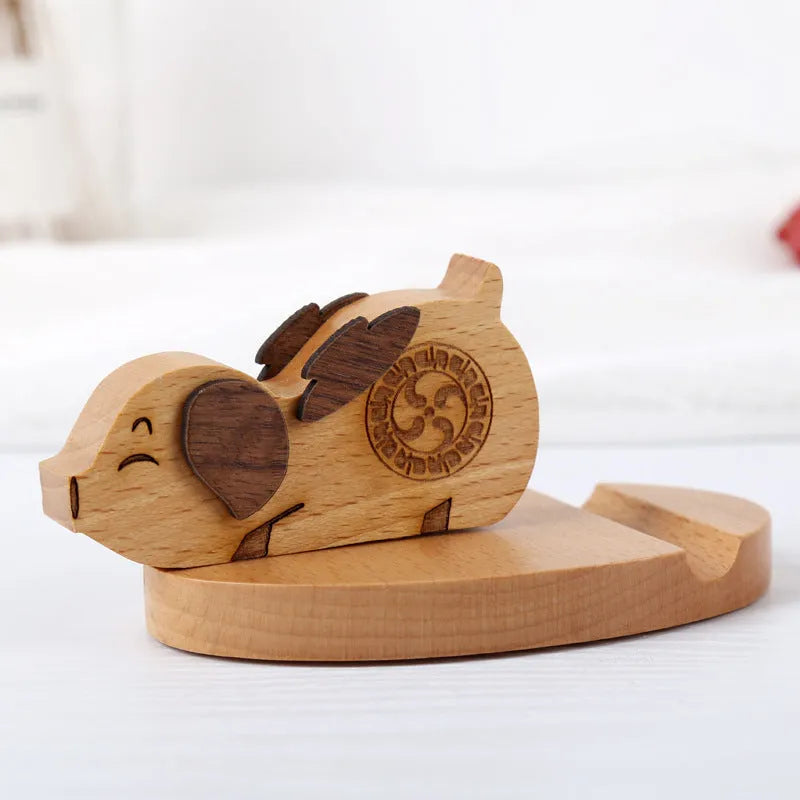 Beech wood mobile phone holder with resin animal design and coin slot