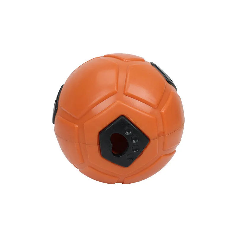 Orange hollow style TPR dog toy ball for nibbling and teeth grinding on a neutral background