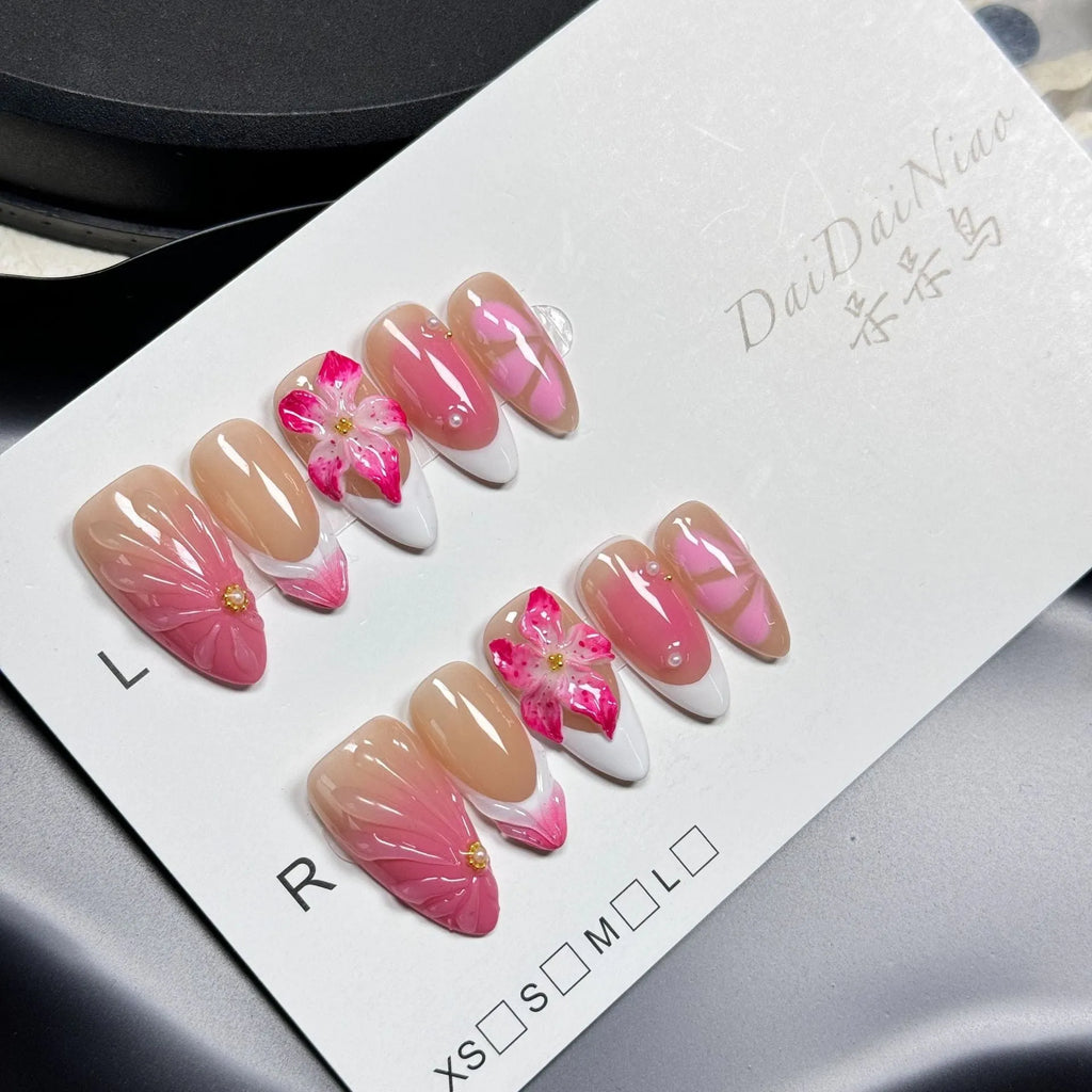 French style artificial nails with 3D lily and ice flower design on almond-shaped plastic tips.