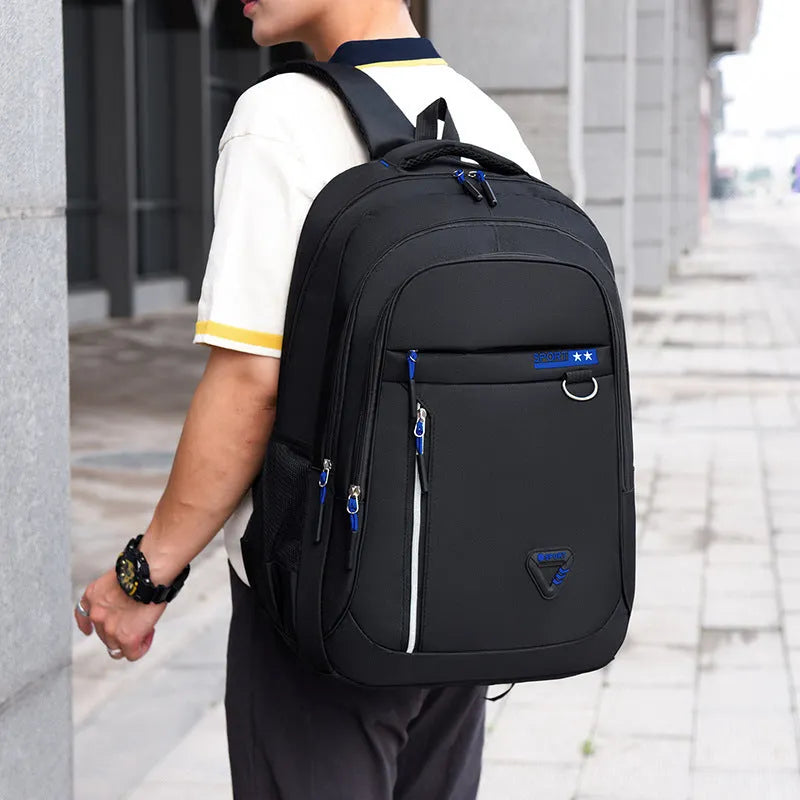 Men's Oxford cloth schoolbag in black showing spliced pattern design and air pillow belt system
