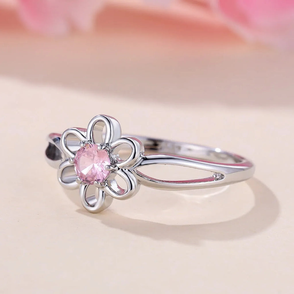 Lady's flower hollowed fashion simple ring in copper with platinum pink diamond electroplated finish