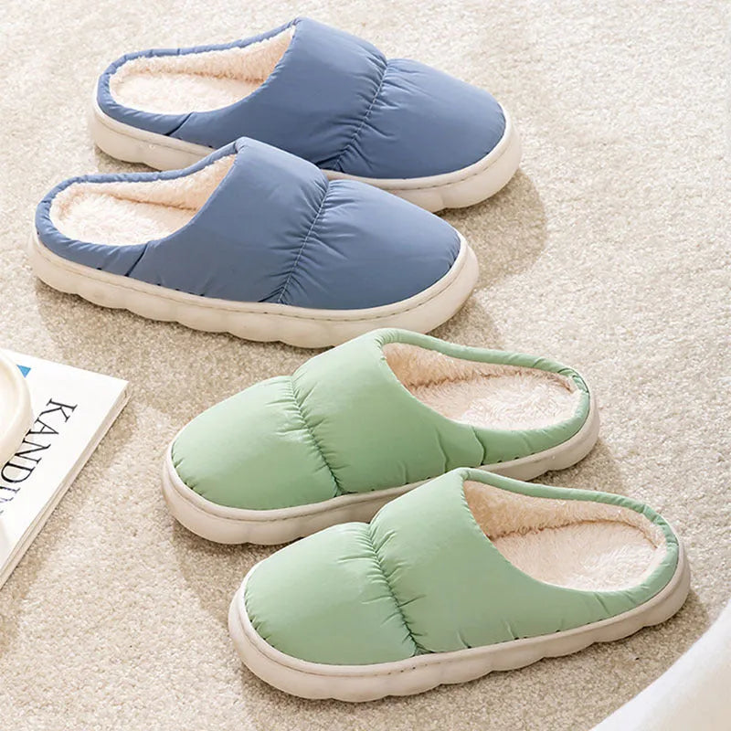 Blue winter house slippers with artificial leather upper, thick rubber sole, and plush lining.