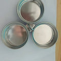 Small stainless steel heart-shaped egg steamer or round egg cooker for use on a hob.