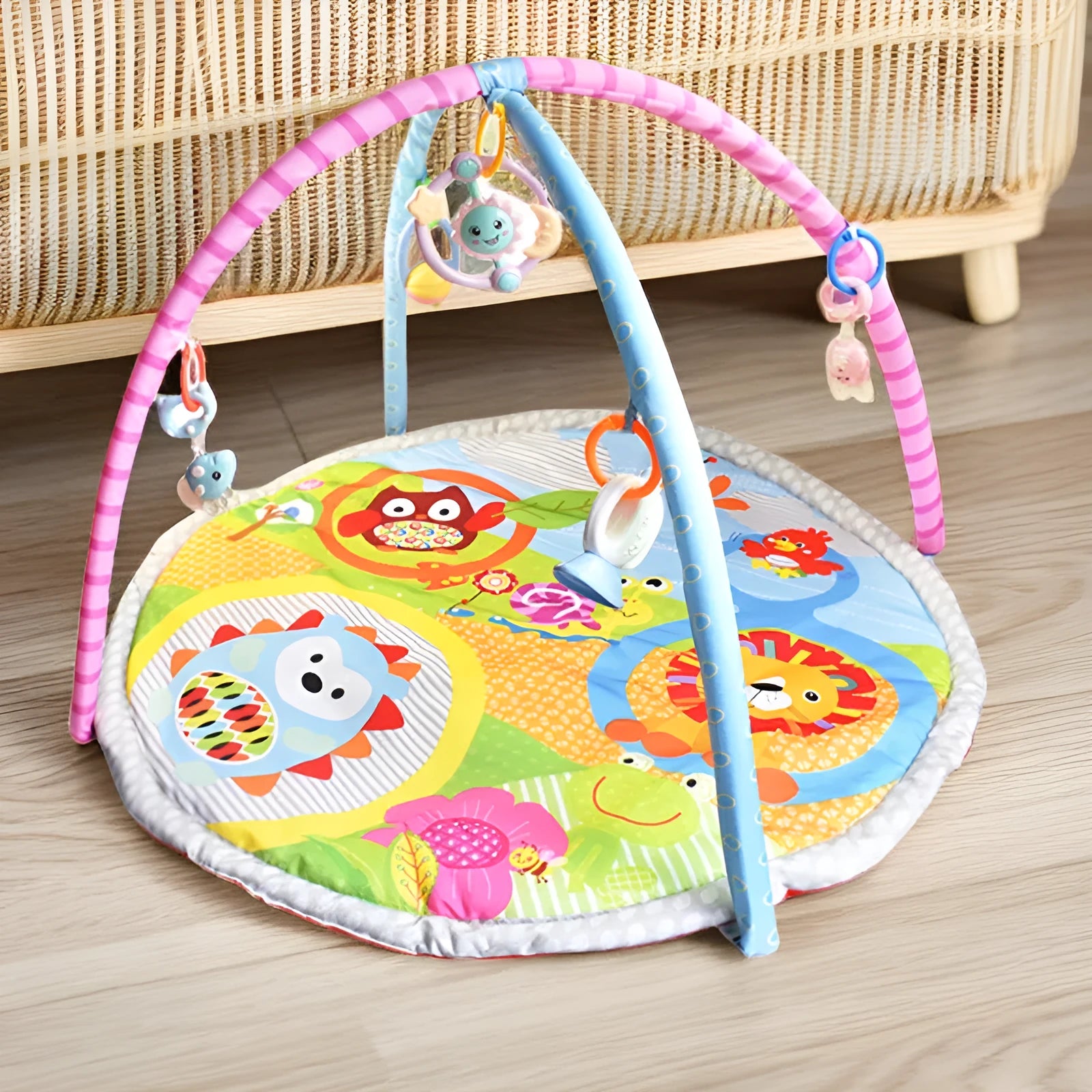 Velvet baby gymnastic blanket with animal pattern used as a crawling carpet and interactive toy.