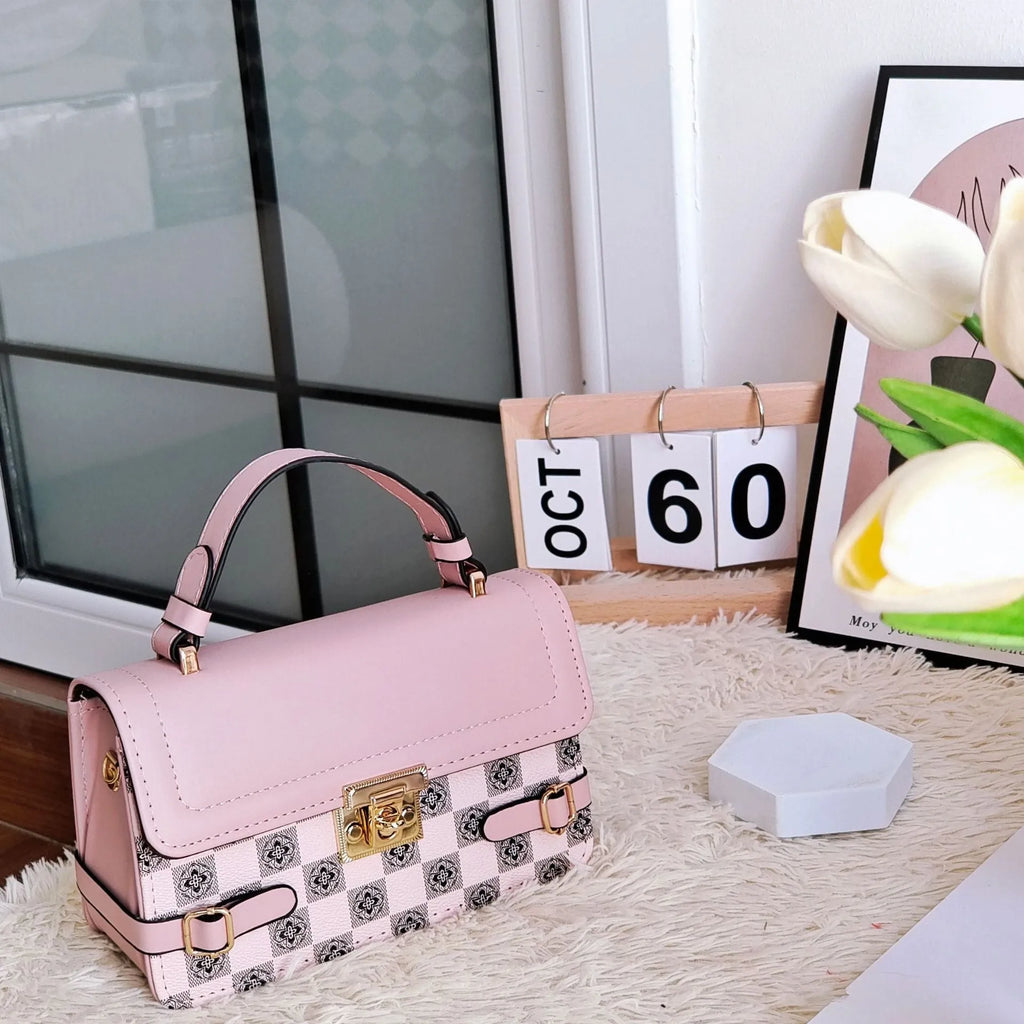 Small square ethnic crossbody bag in apricot PU leather with stitching and plaid patterns.