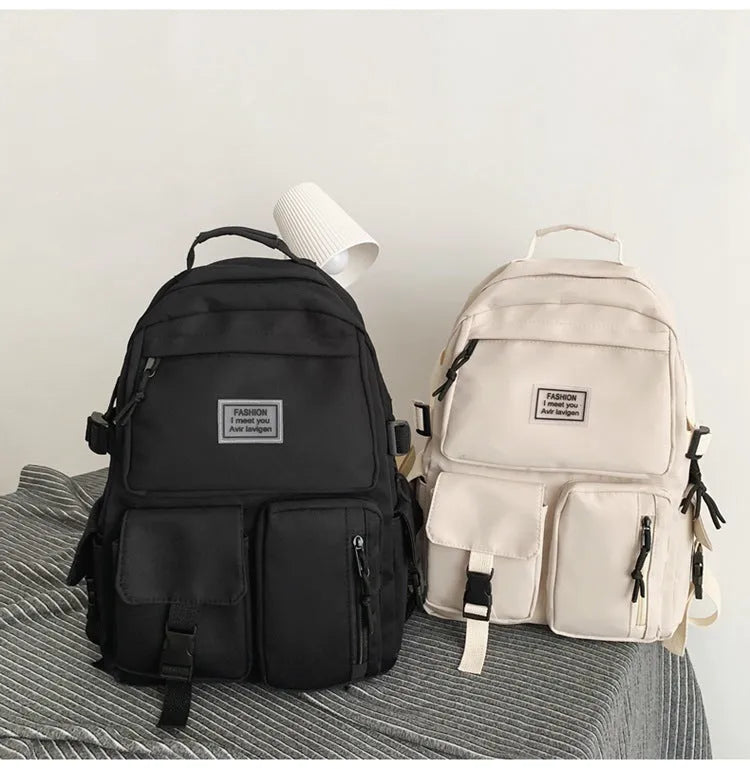 Soft nylon student backpack with computer compartment and three-dimensional pockets in black colour