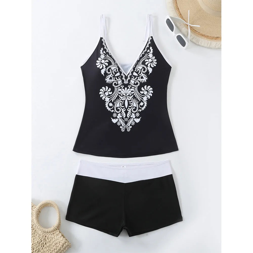 Plus size women's printed two-piece swimsuit in black or rose red with briefs style bottom.
