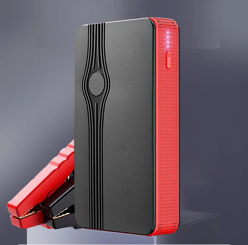 Red K4-E automobile emergency jump starter power bank with data cable, compact rectangular design.