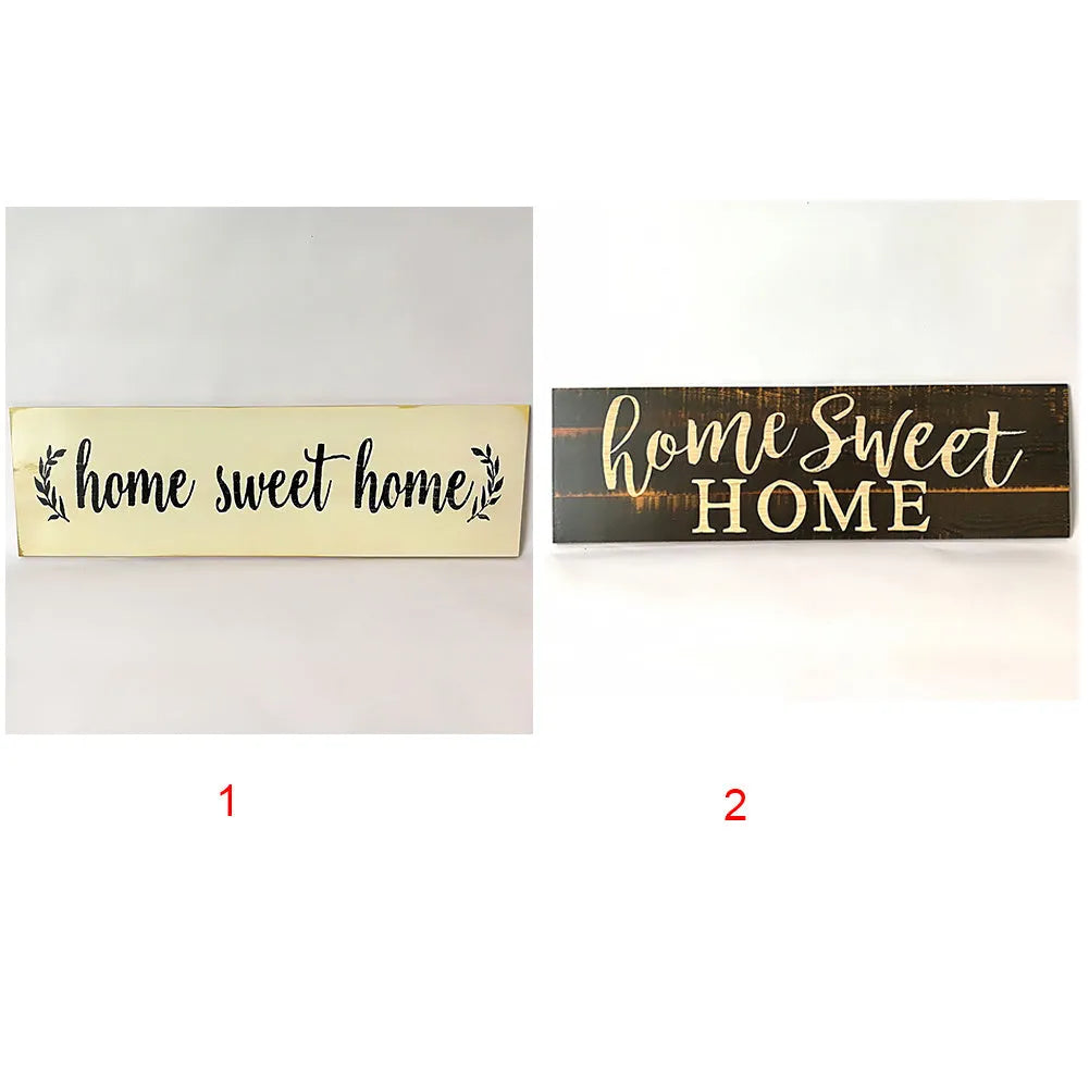 Wooden carved Home Sweet Home hanging pendant decoration in black finish on a light wall