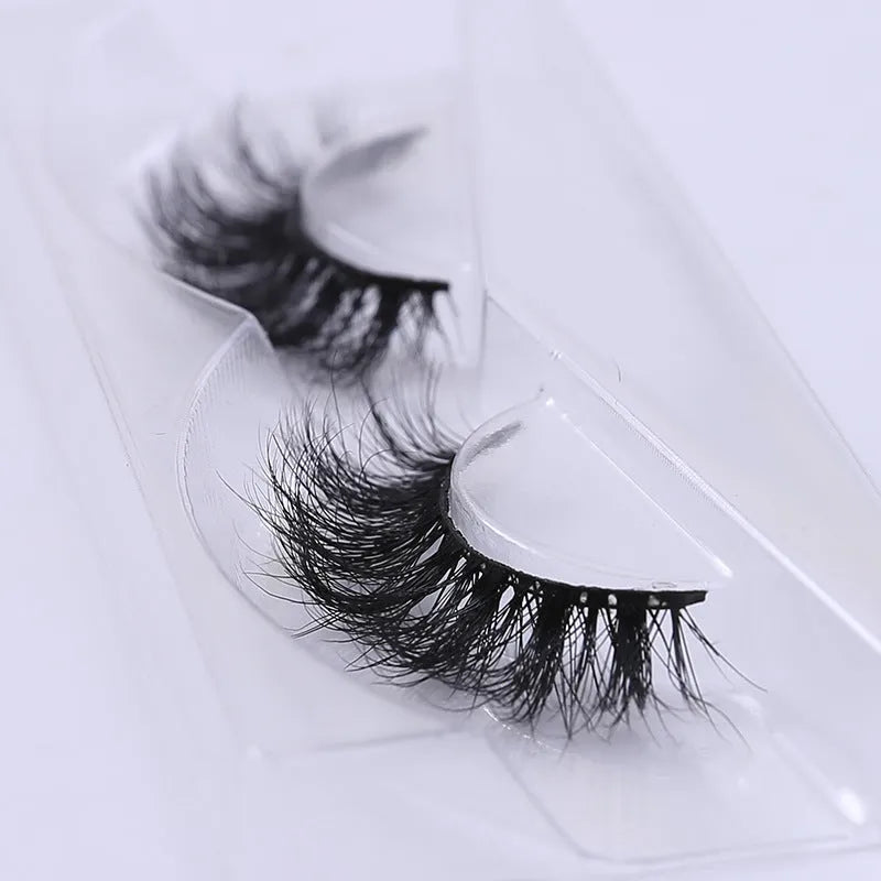Handmade 3D mink full strip false eyelashes in style A01 against a white background