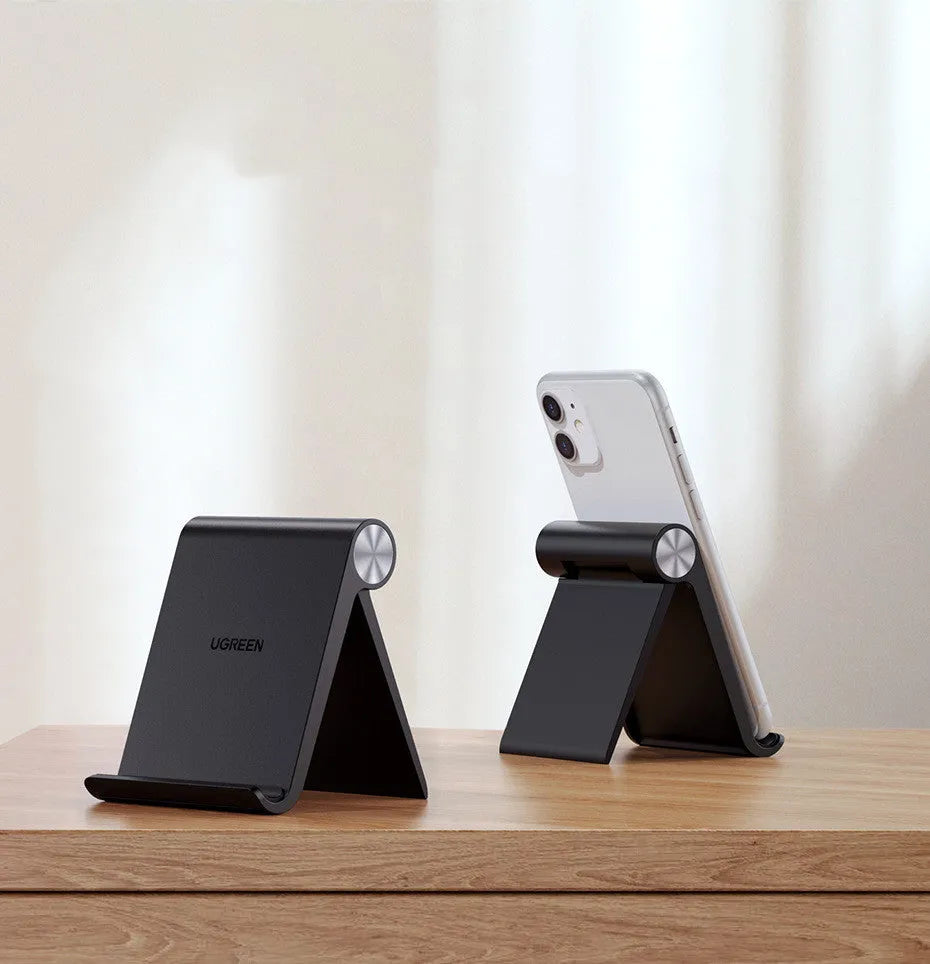UGREEN Lazy Bracket phone holder holding a smartphone in clamp, black colour, portable design
