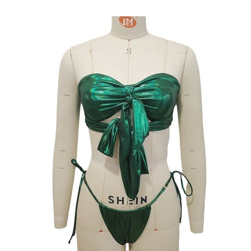 Women's wireless padded swimsuit with front lace-up detail on a split, shown in a small floral print.