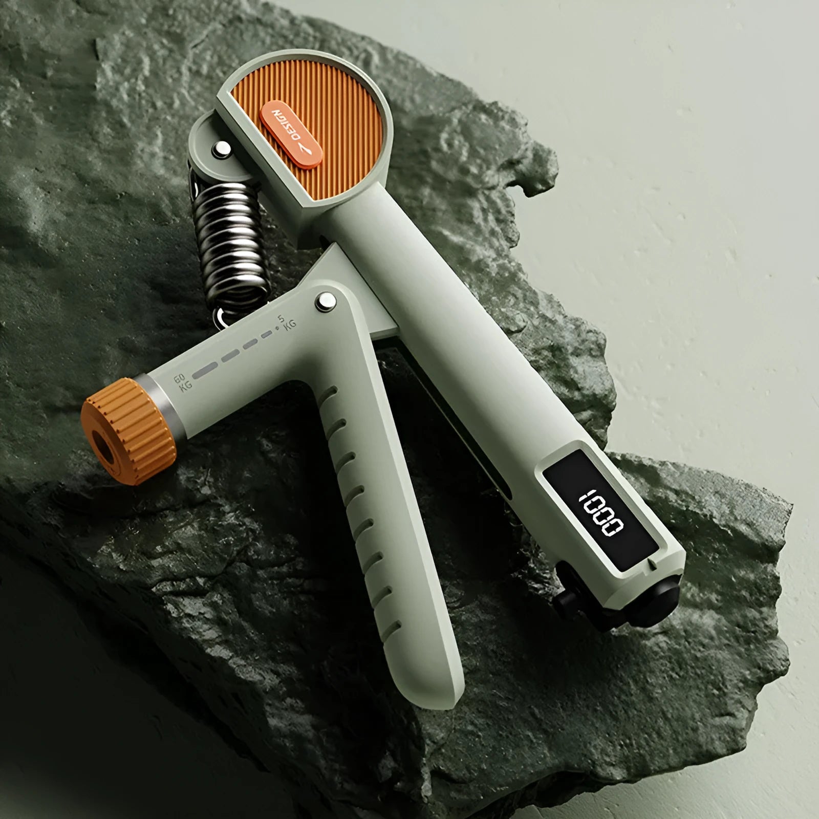 Adjustable spring hand grip strength trainer in ABS plastic, shown in white colour.