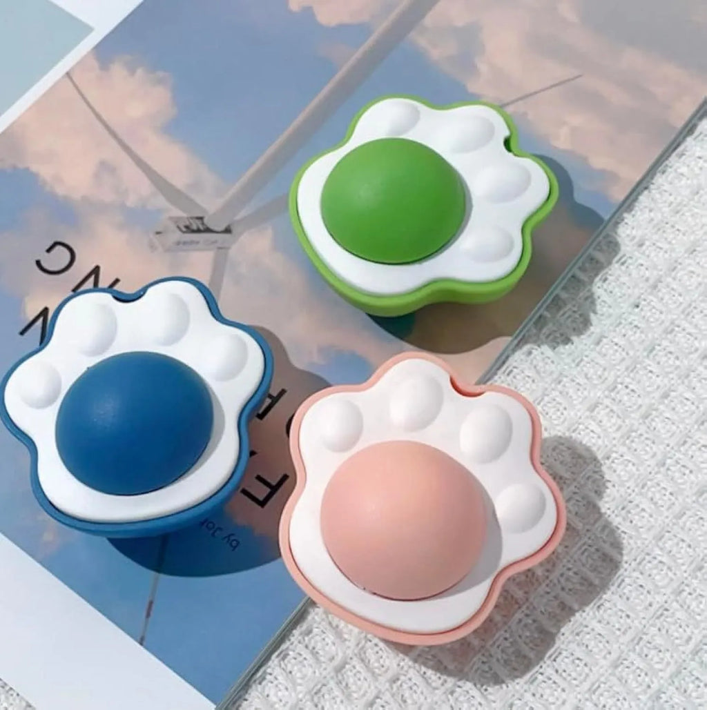 Four catnip dental chew balls in blue, green, pink colours for feline teeth cleaning