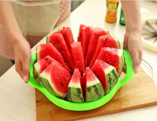 Multi-function fruit slicer cutting watermelon into 12 uniform slices with stainless steel blade and green PP plastic frame