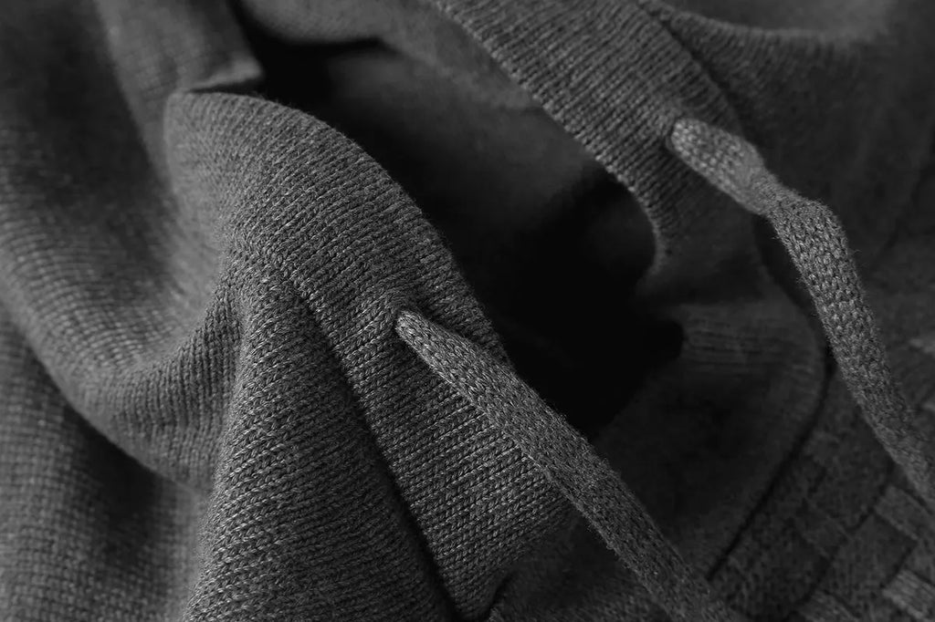 Men's cotton-polyester blend hoodie sweater on a hanger, shown in one of nine available colours.