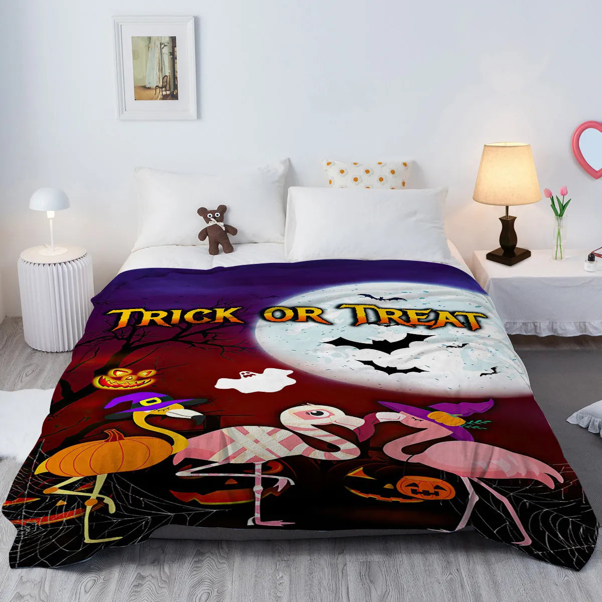 Purple flannel throw blanket with Halloween flamingo print, soft velvet texture, hemmed edges, available in multiple sizes