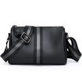 Black genuine leather one-shoulder crossbody bag showing front and strap.