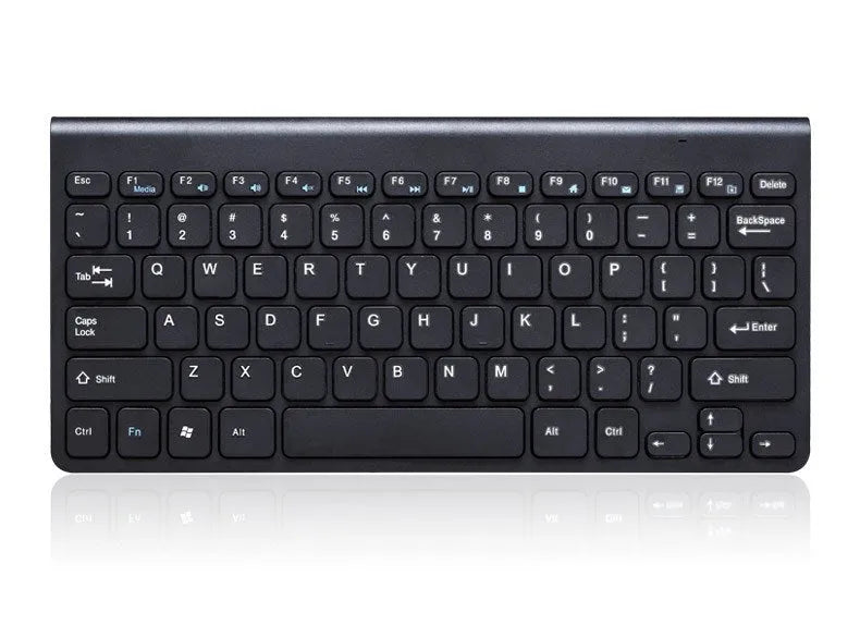 Black wireless keyboard and mouse set on wooden desk with USB receiver