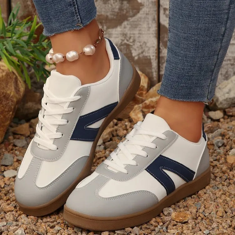 Women's blue flat German training hiking shoes with low top, front lace-up, and rubber sole