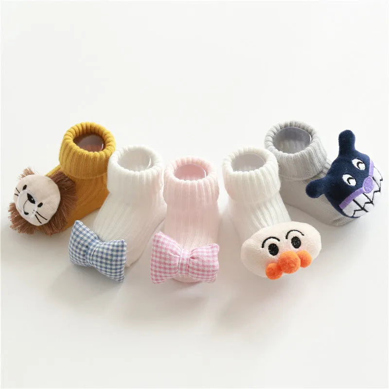 Cotton baby floor socks in multiple patterns including blue bow and lion designs