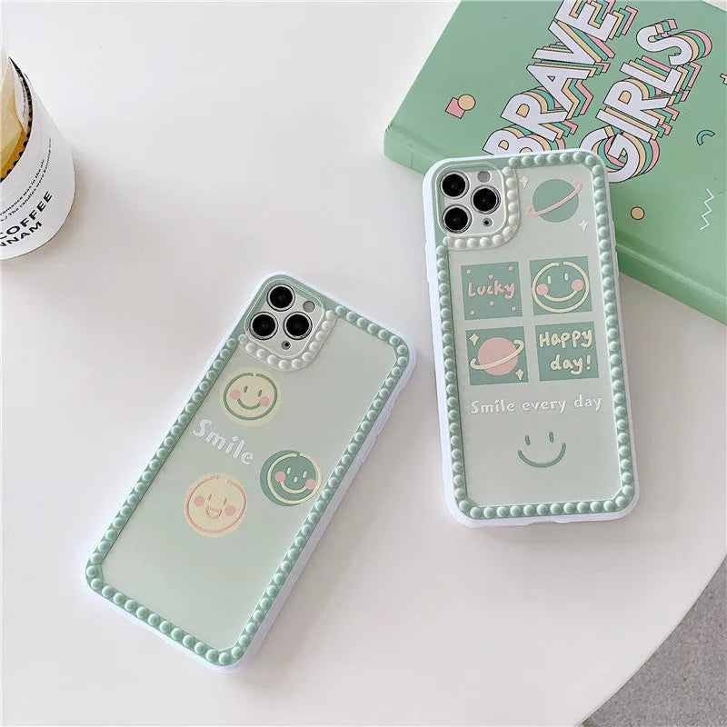 Green TPU iPhone back cover case with geometric smiley face and polka dot design.