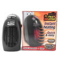 Black portable electric ceramic heater with digital display and rotating plug on a table