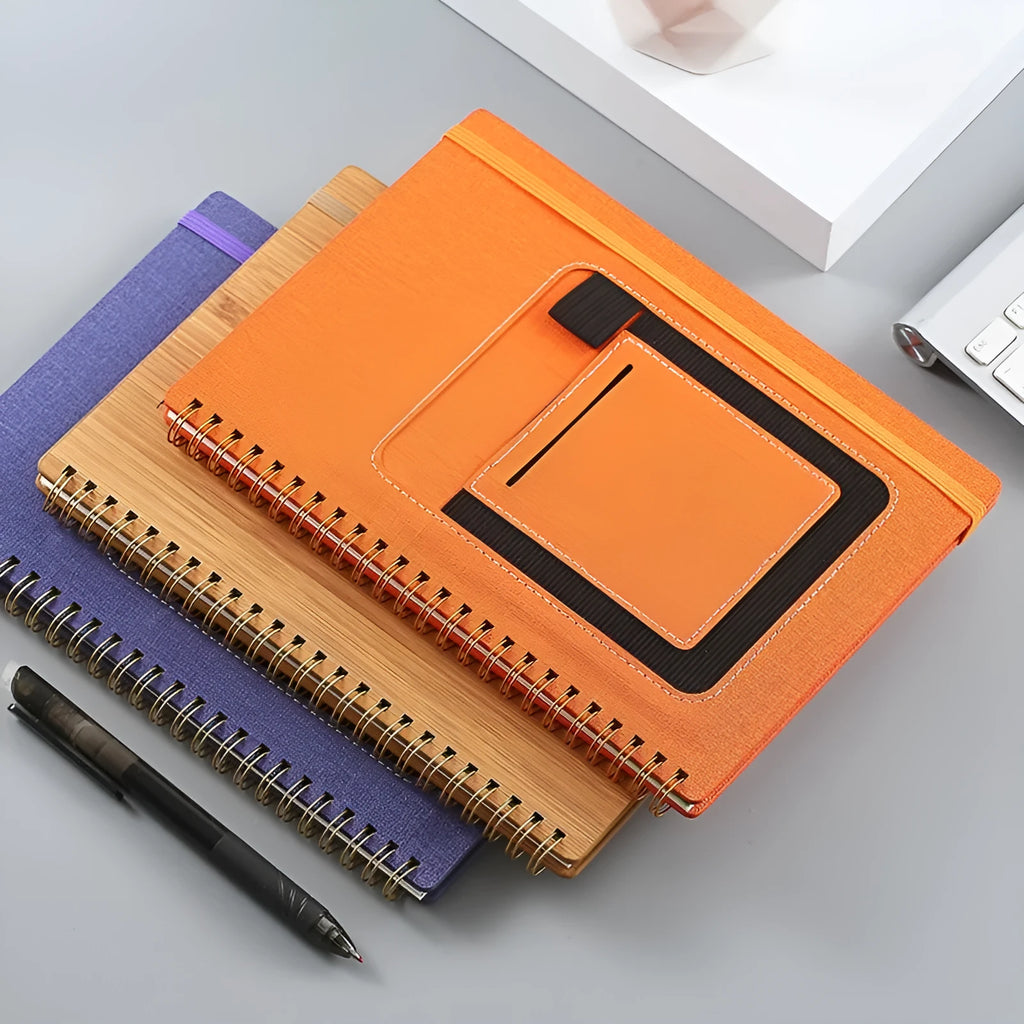 A5 coil-bound erasable notebook with waterproof stone paper in a customisable cover, shown with a pen.