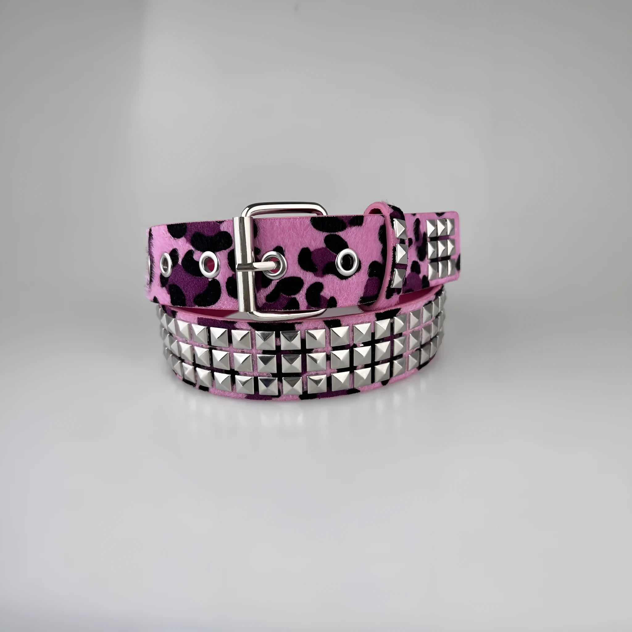 Punk women's belt with metal rivets in leopard or zebra print patterns showing alloy buckle