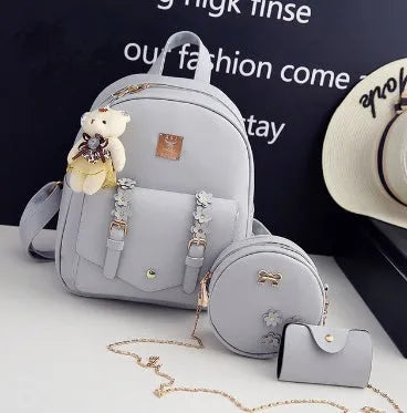 Three-piece PU leather bag set for teenage girls including backpack, shoulder bag and card holder