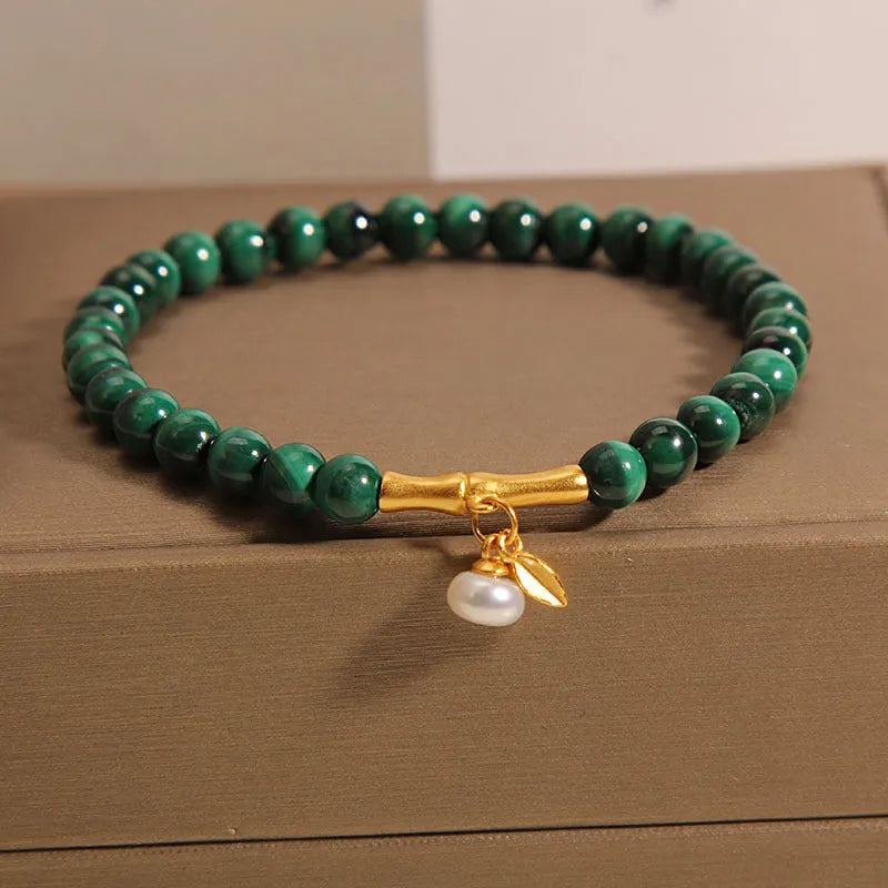 Women's lucky bamboo bracelet with white crystal beads on adjustable gold-toned chain