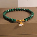 Women's lucky bamboo bracelet with white crystal beads on adjustable gold-toned chain