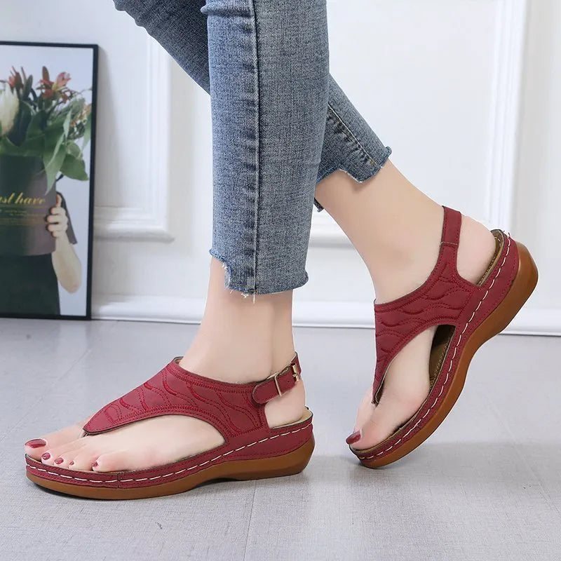 Women's casual wedge heel sandals in black with an adjustable back strap buckle.