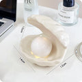 White porcelain girls ornament tray with small night light, shown in yellow and pink shell options.