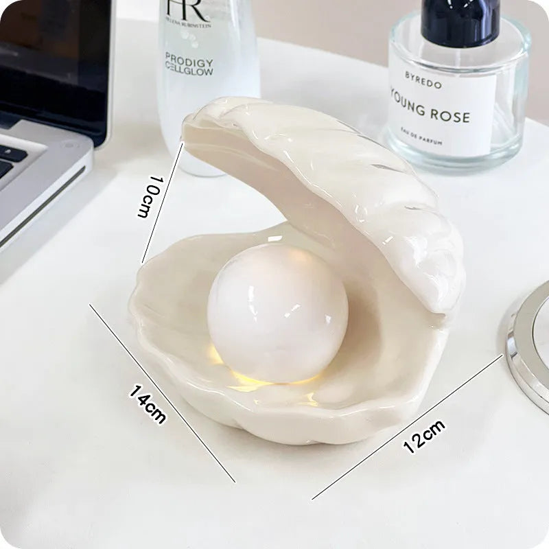 White porcelain girls ornament tray with small night light, shown in yellow and pink shell options.