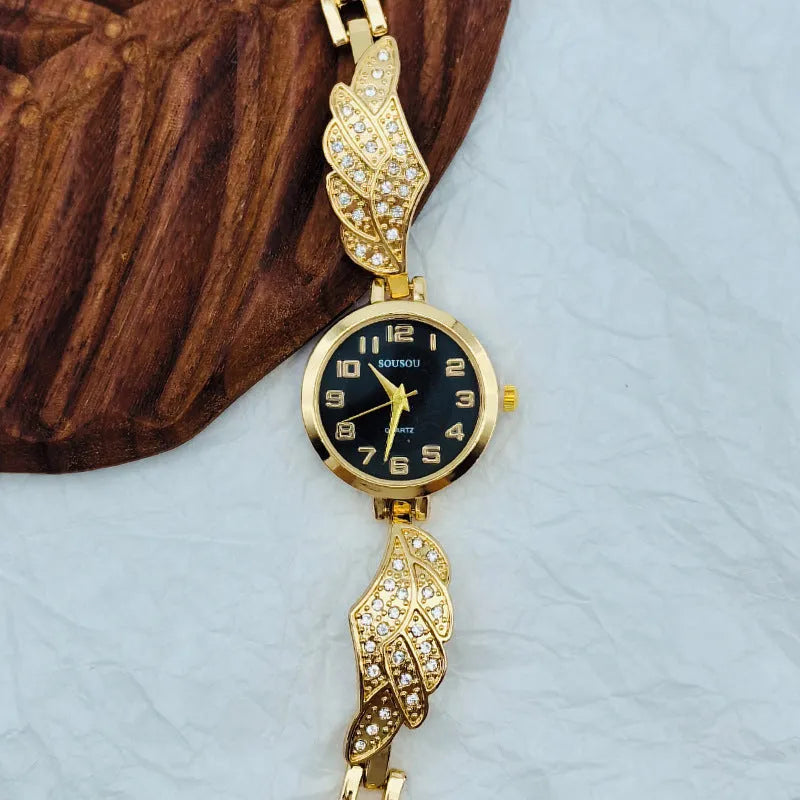 Women's stainless steel watch with round dial showing gold face colour option and Vachette clasp buckle